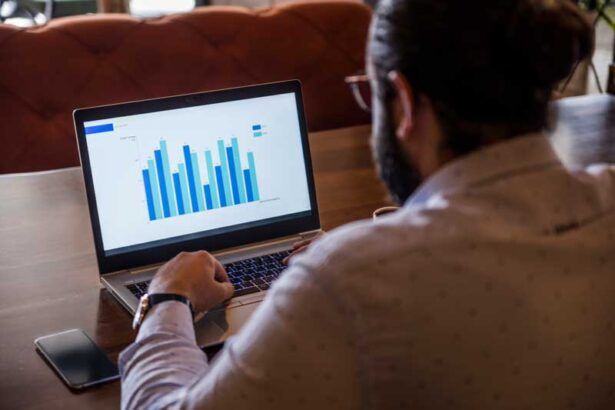 A business owner reviews his drivers’ fleet card usage from his laptop.