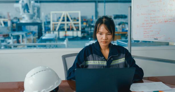 A construction company owner reviews the tax reporting available from her fleet card dashboard.