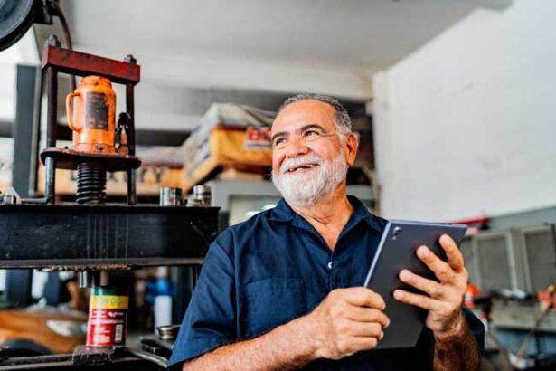 A happy business owner reviews his fleet’s fuel card usage in real-time on his tablet.