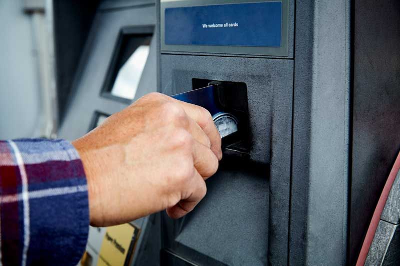 A trucker pays for his fuel with a fleet fuel card.